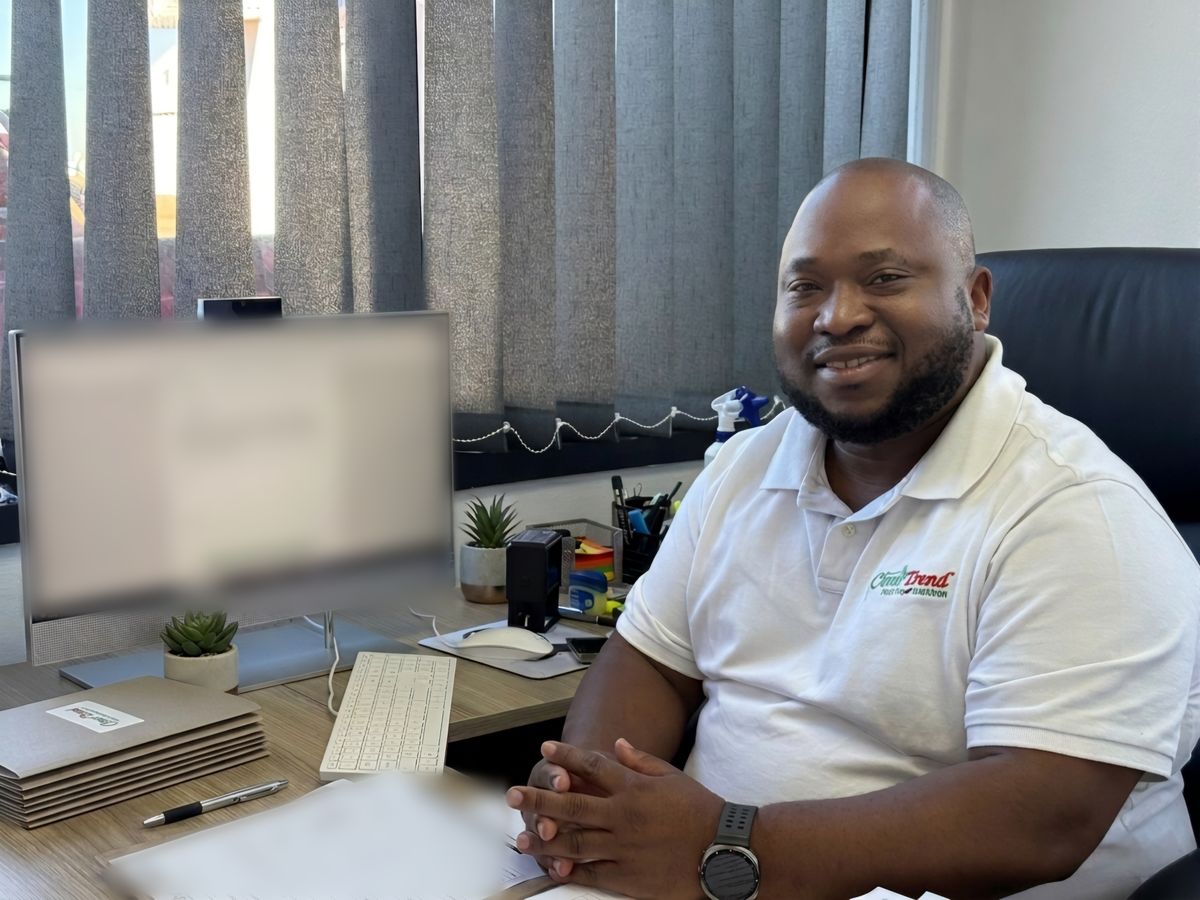 Dr A.O. Ndhlovu at his desk at the practice, Grand Central Airport, Midrand